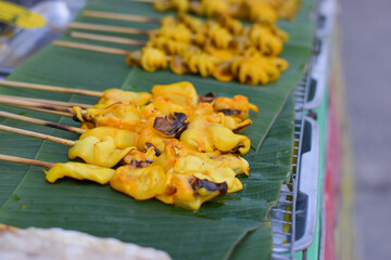 Grilled squid placed on banana leaves