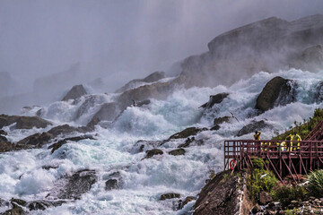 dramatic and spectacular image of the Niagara Falls taken during summer.