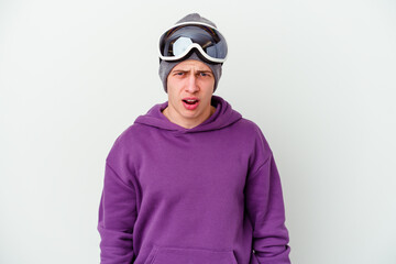 Young man holding a snowboard board isolated on white background screaming very angry and aggressive.