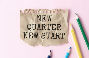 Text NEW quarter NEW START on white notepad page. Table desk top view, flat lay