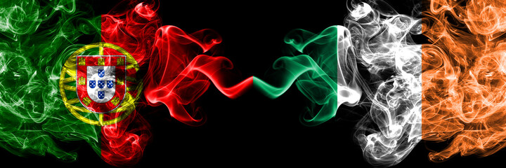 Portugal, Portuguese vs Ireland, Irish smoky mystic flags placed side by side. Thick colored silky abstract smoke flags.