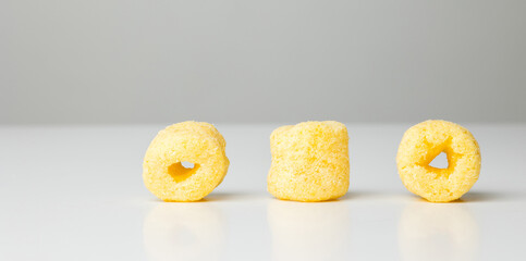 Crispy Corn rings salty snacks. Fast food or junk food snacks unhealthy concept.