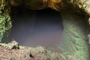 The misty entrance to Jomblang Cave, Yogyakarta, Indonesia
