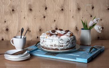Preparing for a festive tea party. Homemade cake and white tableware