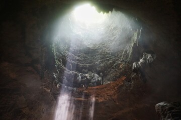 Beautiful ray of light inside Jomblang Cave, Yogyakarta, Indonesia
