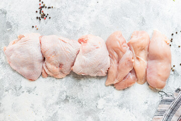 chicken raw meat pieces of poultry carcass breast, thigh, wings snack healthy meal top view copy space for text food background rustic image keto or paleo diet