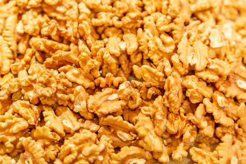 Textured surface of dry walnut of the Juglandaceae family. Healthy food ingredient