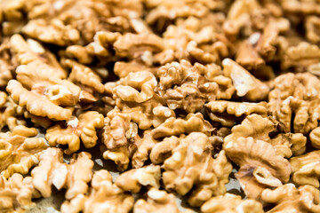 Textured surface of dry walnut of the Juglandaceae family. Healthy food ingredient