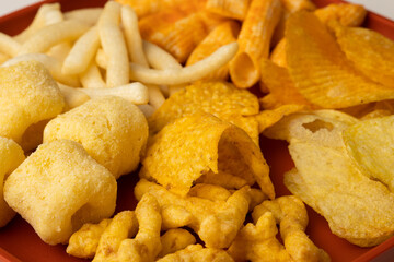 Many Crispy Snacks food potato chip salty. Fast food or junk food snacks unhealthy concept.