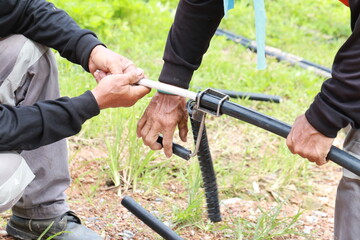 Hand of electrician repairman worker  cutting cable. Industrial mounting concept. Professional...