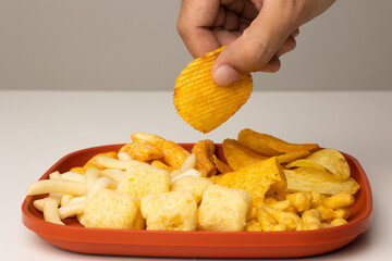 Many Crispy Snacks food potato chip salty. Fast food or junk food snacks unhealthy concept.
