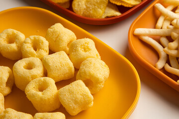 Many Crispy Snacks food potato chip salty. Fast food or junk food snacks unhealthy concept.