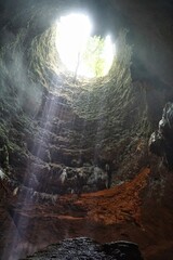 Beautiful ray of light inside Jomblang Cave, Yogyakarta, Indonesia