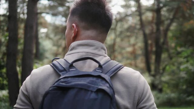 Happy Asian Man With Backpack Walking On Path Forest. Summer Holiday And Vacation Trip, Korean Hiker Student On Digital Detox, Walking Tour Vacation, Close To The Nature, Cardio Training