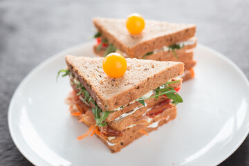 Tasty looking sandwiches on a white plate