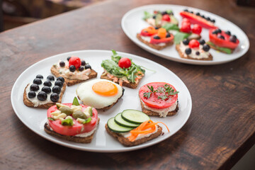Freesh vegetarian sandwiches on a white plate