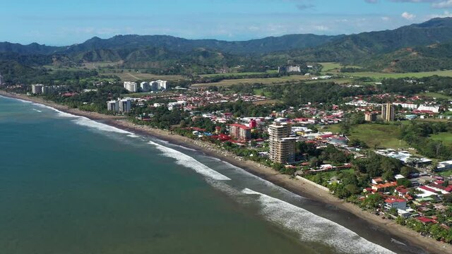 Aerial view of Jaco Costa Rica city black sand beach with resorts 