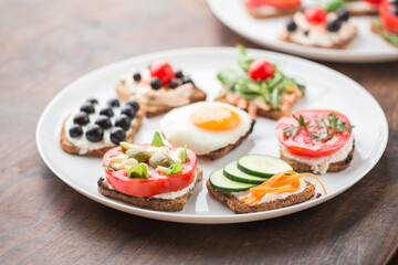 Freesh vegetarian sandwiches on a white plate