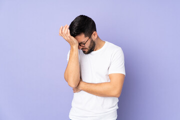 Caucasian handsome man over isolated background with headache