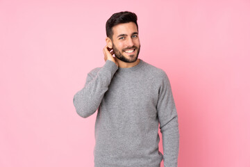 Caucasian handsome man over isolated background laughing
