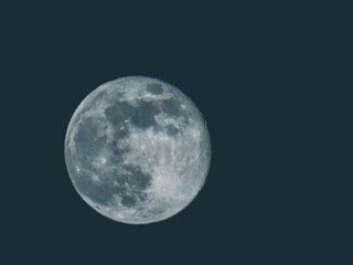 Earth's Moon Glowing with different colours in the Background.
Blue and red moon watched by telescope.