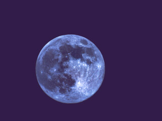 Earth's Moon Glowing with different colours in the Background.
Blue and red moon watched by telescope.