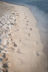 Footprints on the beach sand