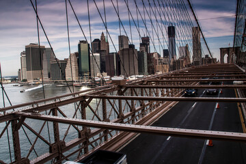 The Brooklyn bridge in  New York with the Manhattan skyline on the background.
