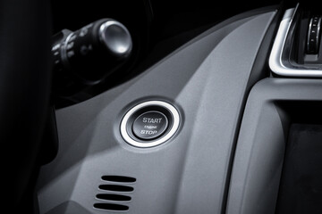 Obraz na płótnie Canvas Start and stop engine button in a modern car