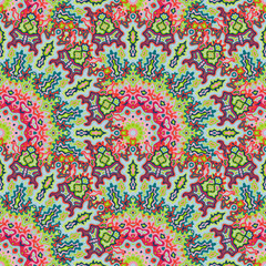 Fototapeta premium Mandala flower seamless ornament. Islamic folk vector graphic design. Weave vintage kaleidoscope geometric seamless pattern. Wrapping paper print.