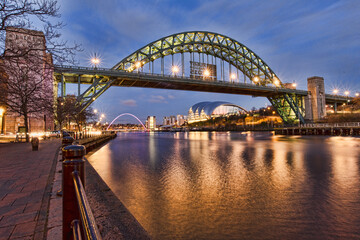 Fototapeta na wymiar Looking down the Tyne River to Gateshead and the Tyne bridge from Newcastle Upon Tyne Quayside