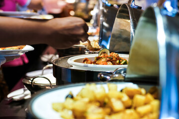 Hand of people grab buffet food self serving in hotel seminar