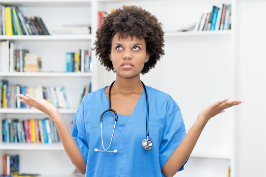 Angry afro american female nurse at work