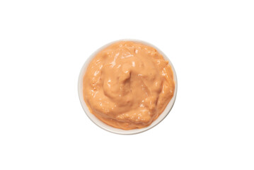 Sauce in a bowl isolated on white.