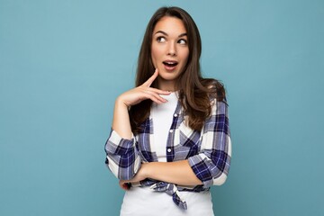 Closeup photo of amazing thoughtful beautiful young woman having an idea holding arm on chin wearing stylish outfit isolated on colorful background with copy space