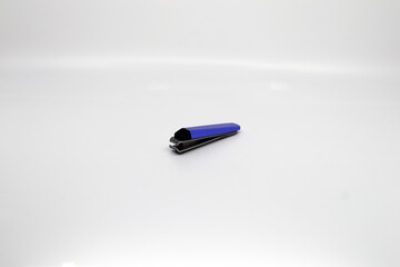 a long-used purple nail clipper