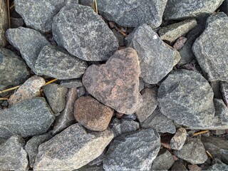texture and background of colored stones on the river bank in the daytime