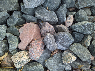 texture and background of colored stones on the river bank in the daytime
