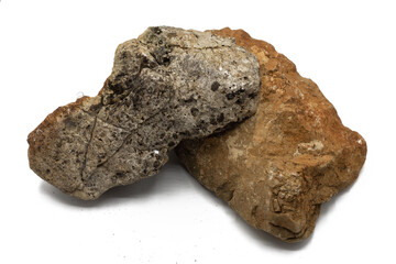 Orange and grey rocks with soft shadows isolated on white background. Horizontal shot. Clipping path, graphic resources for projects and nature concept.