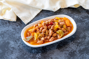 Kidney bean appetizer. Traditional Turkish and Arabic cuisine meze. Snack meal served alongside the main course. Natural vegetarian food. Barbunya plaki. Chili beans