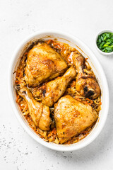 Roasted garlic chicken and vegetables in baking dish. Space for text, top view.