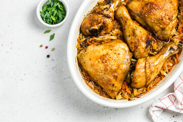Roast chicken and vegetables in baking dish. Space for text, top view.