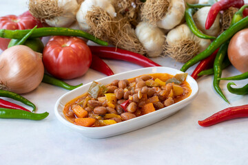Kidney bean appetizer. Traditional Turkish and Arabic cuisine meze. Snack meal served alongside the main course. Natural vegetarian food. Barbunya plaki. Chili beans