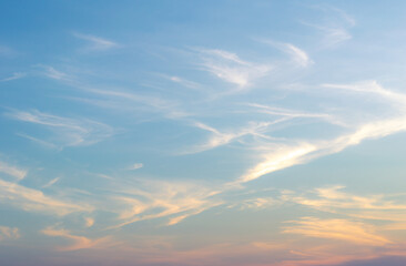 Beautiful Vivid sky painted by the sun leaving bright golden shades.Dense clouds in twilight sky in...