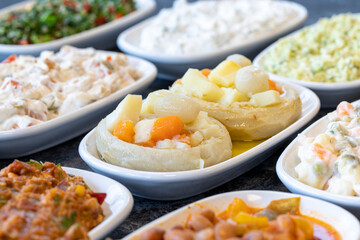 Artichoke Salad Appetizer. Healthy food. Traditional Turkish and Arabic cuisine meze. Bulk mezze plates. Natural vegetarian food. Local name enginar salatası