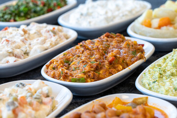 Spicy appetizer. Traditional Turkish and Arabic cuisine meze. Snack meal served alongside the main course. Natural vegetarian food. Bulk appetizer plates. Local name yandım hacer