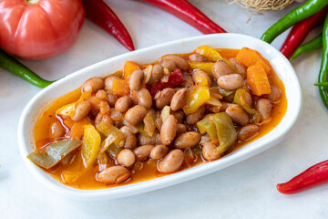 Kidney bean appetizer. Traditional Turkish and Arabic cuisine meze. Snack meal served alongside the main course. Natural vegetarian food. Barbunya plaki. Chili beans