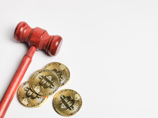Selective focus image bitcoin with gavel on white background paper.