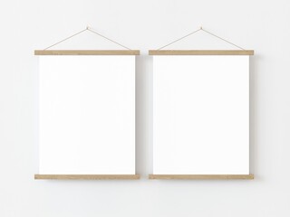 Two vertical rectangle roll up poster mockup with light wood border hanging on a white wall in empty room. Isolated roll up poster mockup template on white background. 3D illustration
