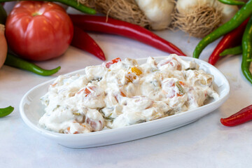 Panco appetizer prepared with potatoes, yogurt and peppers. Traditional Turkish and Arabic cuisine meze. Snack meal served alongside the main course. Natural vegetarian food. Local name Panco mezze
